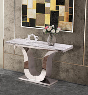 White marble console table with stainless steel U-shaped base, styled in modern home interior