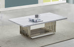 White marble coffee table with chrome steel base and modern rectangular design on rug