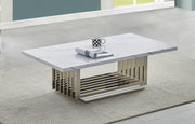 White marble coffee table with chrome steel base and modern rectangular design on rug