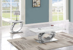 Modern 2 piece white marble coffee table set with oval stainless steel base displayed in living room