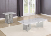 A modern 2 piece rectangular coffee table set with a white marble top and sculptural chrome base