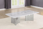 A rectangular coffee table with a white marble-patterned top and a polished silver metallic base, shown in a modern living room setting.
