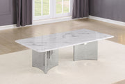 A rectangular coffee table with a white marble-patterned top and a polished silver metallic base, shown in a modern living room setting.